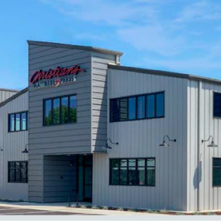 Modern building with 'Ovation' branding on a clear day