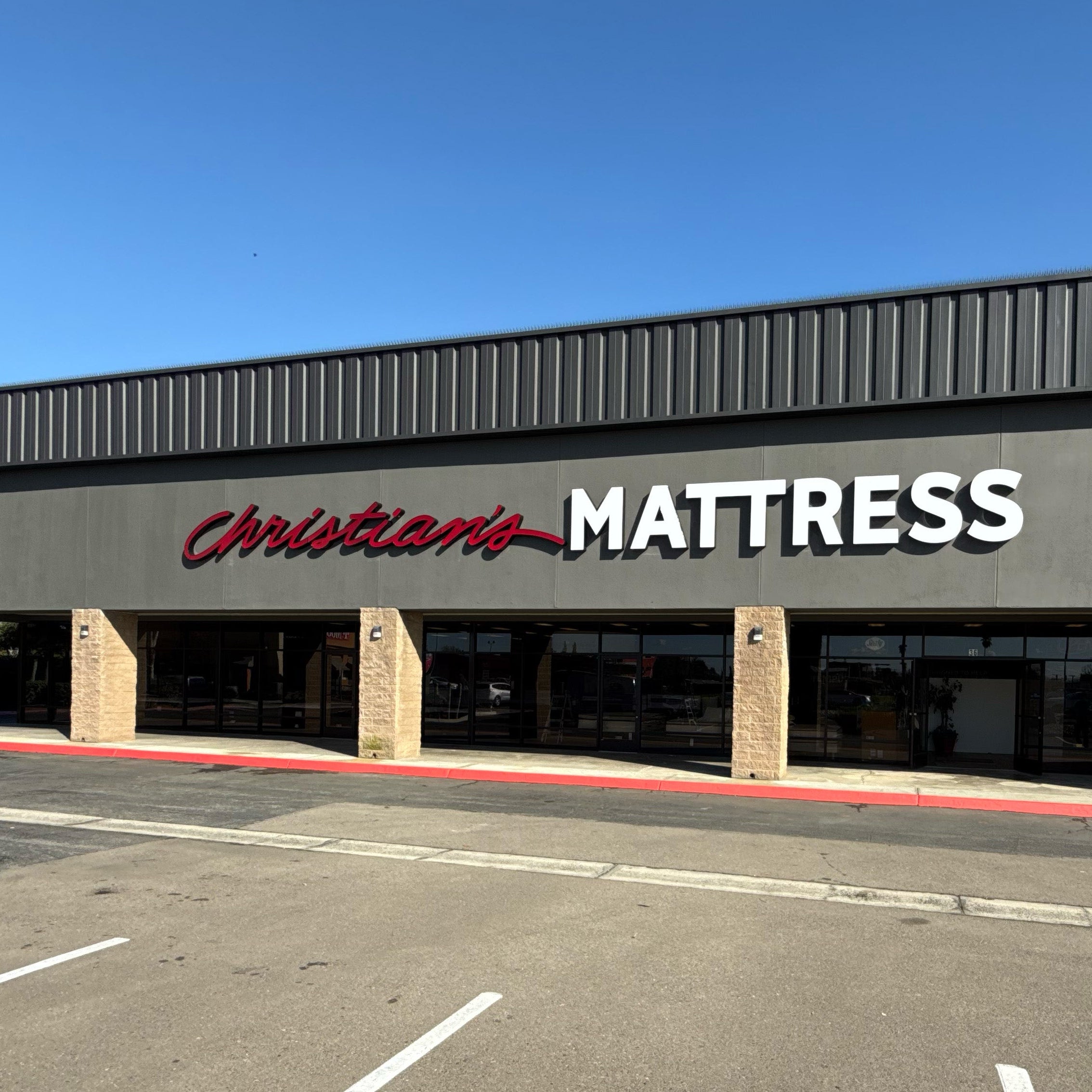 Christian Mattress store exterior with clear blue sky